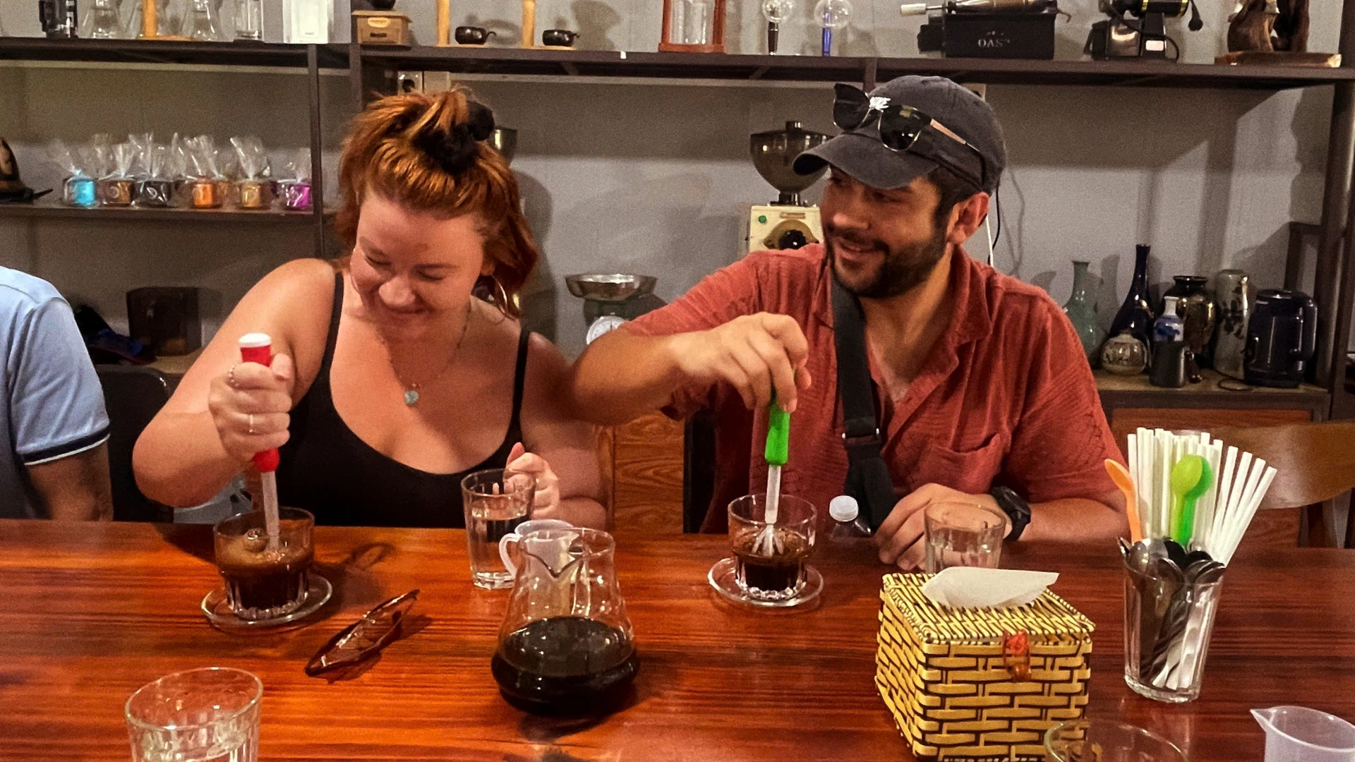 Using hand whisks to froth our coffee