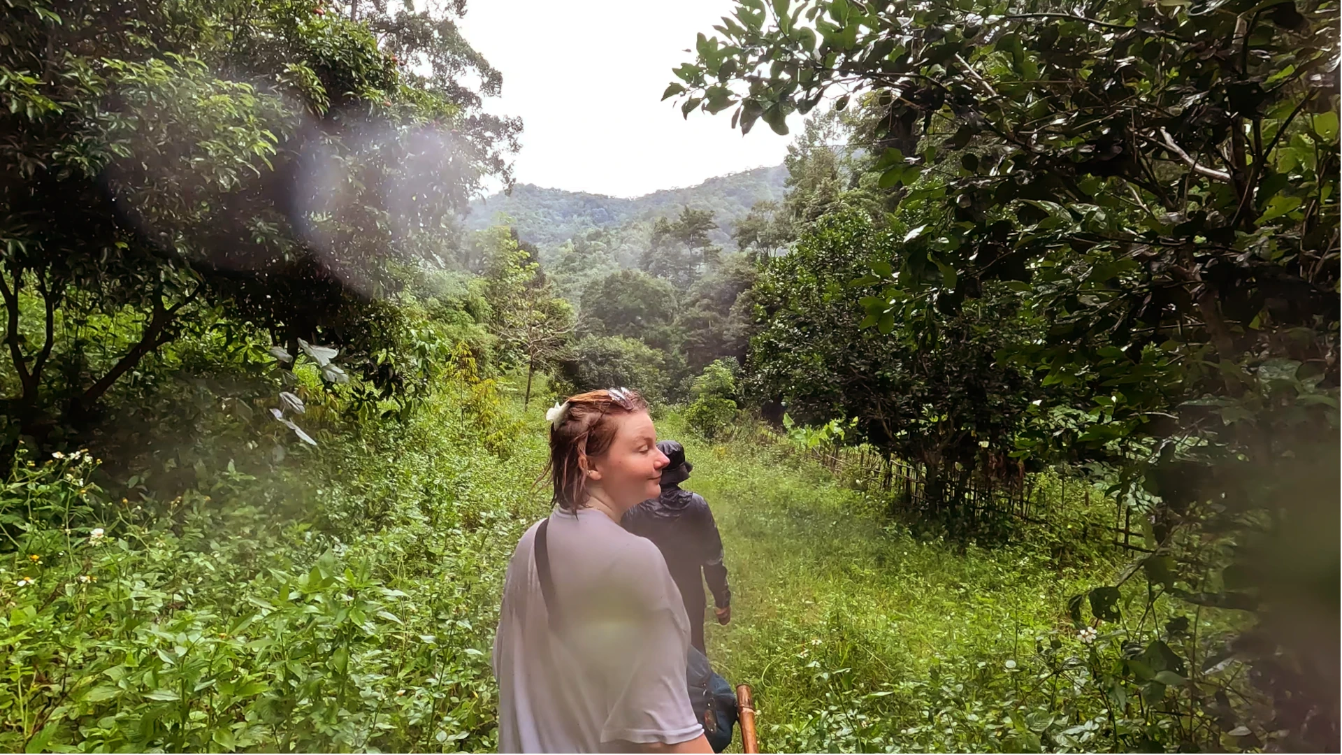 Eloise trekking in the rainy jungle