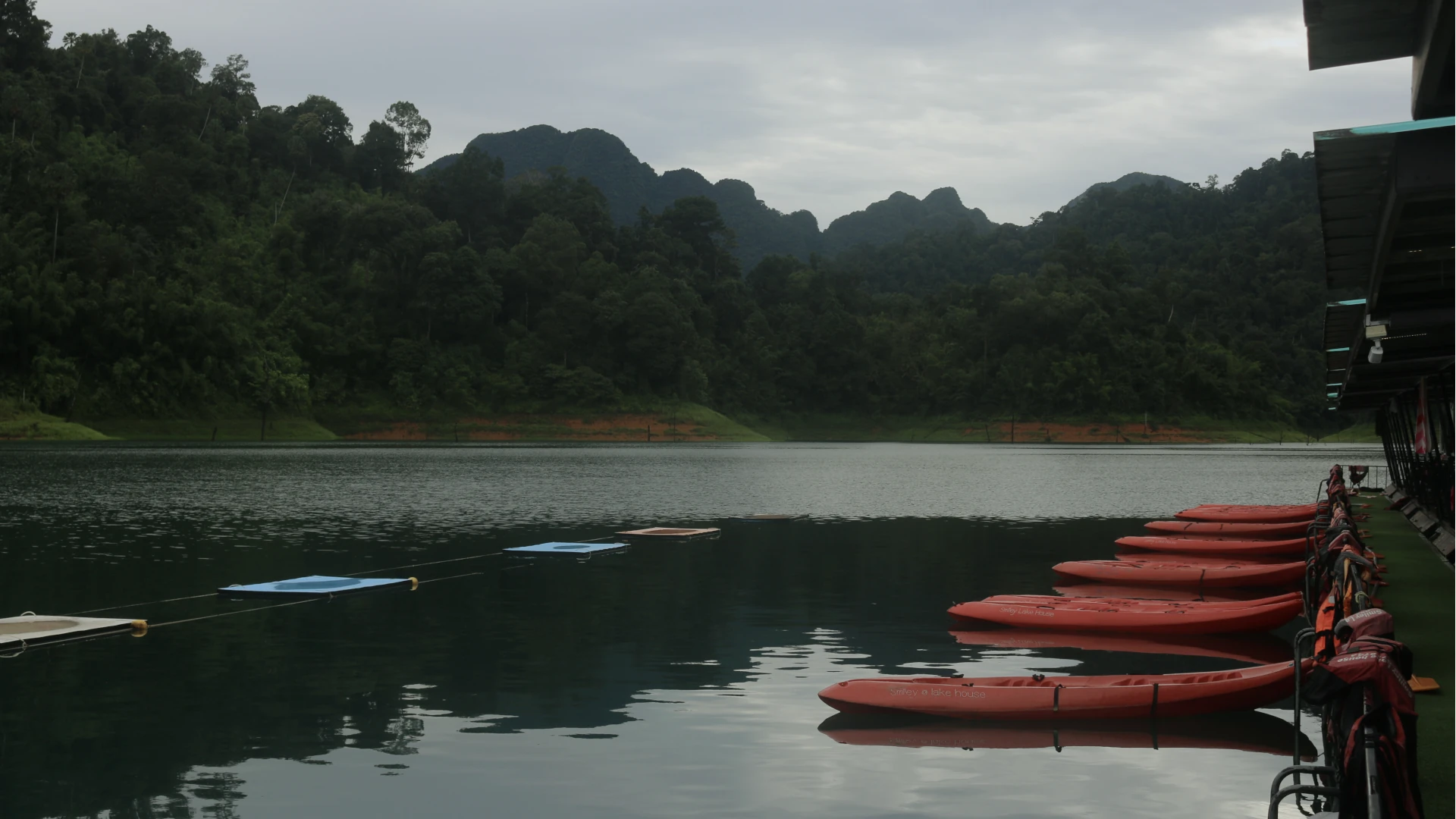 kayaks lined up outside the floating bungalows